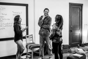 Derik Eselius, lead teacher trainer talking with yoga students.